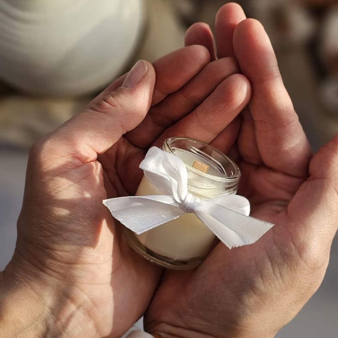 40ml wedding favour candle in hands. Candle made by Kiko Art