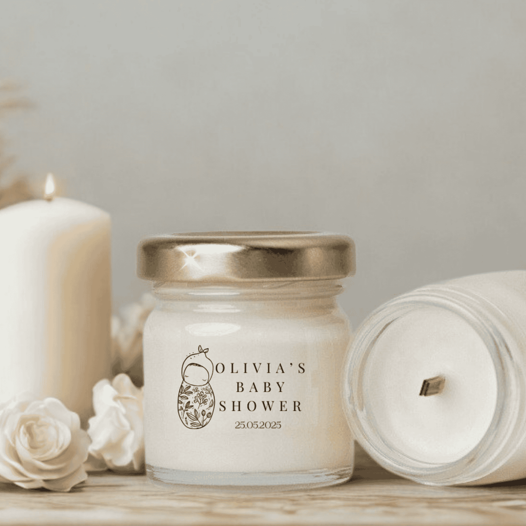Personalized candle jar with 'Olivia's Baby Shower' text on a neutral background