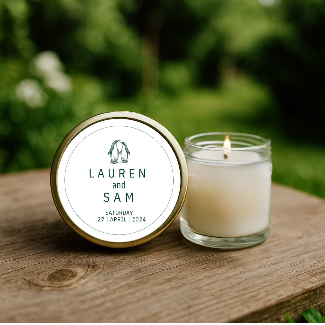 Penguin Pair personalised wedding favour candle – 40ml soy with illustrated penguins, names and wedding date label. Handmade by KIKO Art.