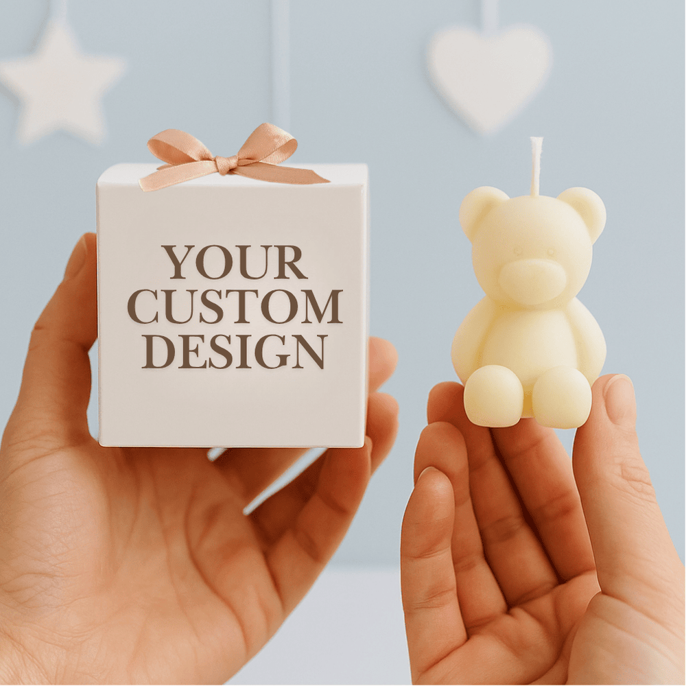 Small white box with 'Your Custom Design' text and a bear-shaped candle held by hands against a light blue background.