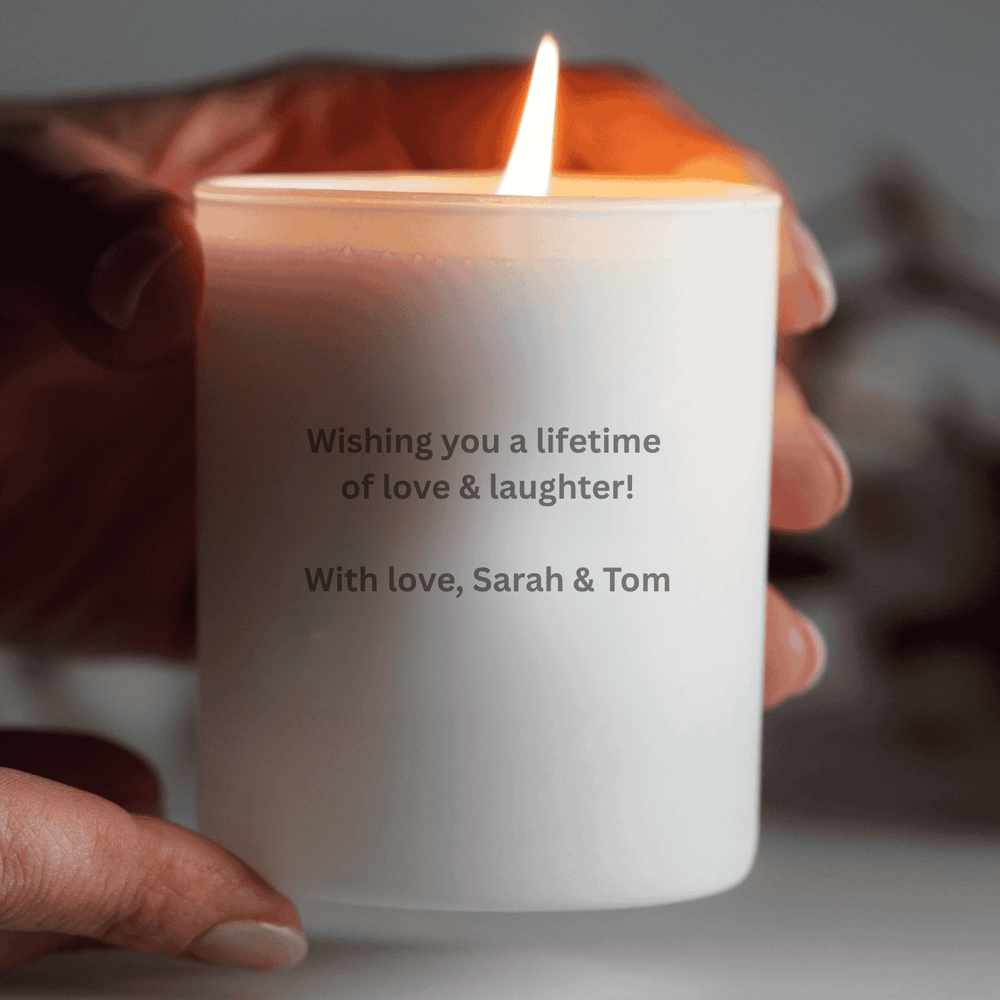 white engraved candle with message