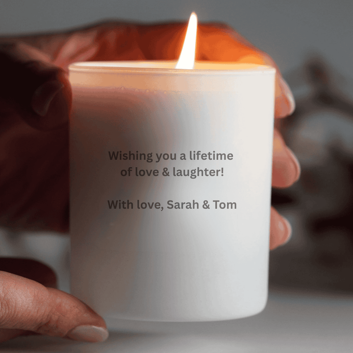 white engraved candle with message